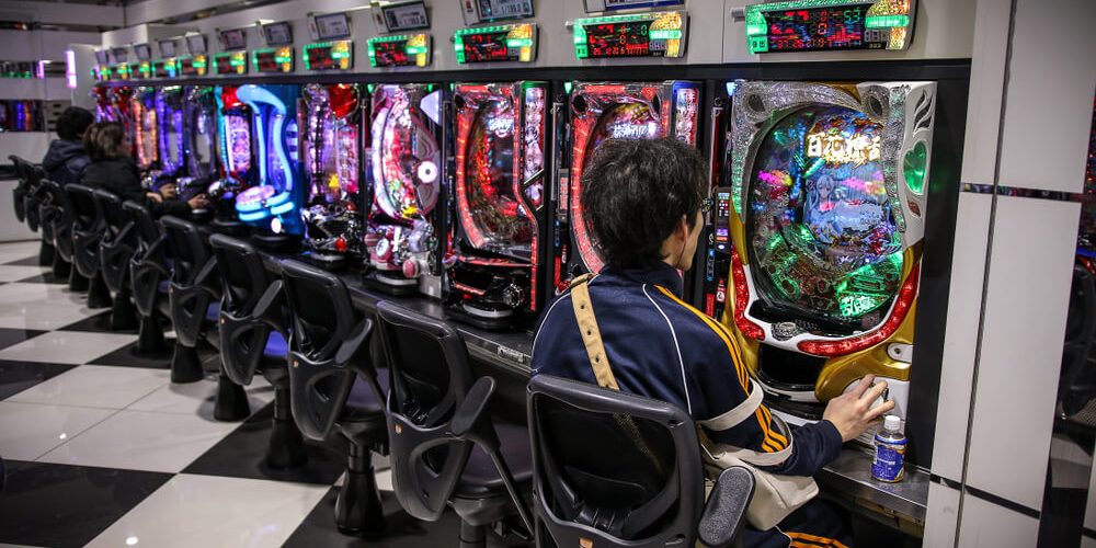Tokyo, JAPAN - 25 October 2017: Pachinko arcade game and gambling. In Japan, people playing this game like a slot machine. Very colorful and noisy area.
