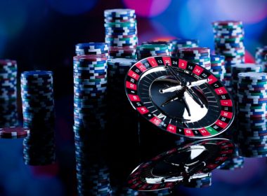 Gambling in casino. Poker chips, roulette wheel.